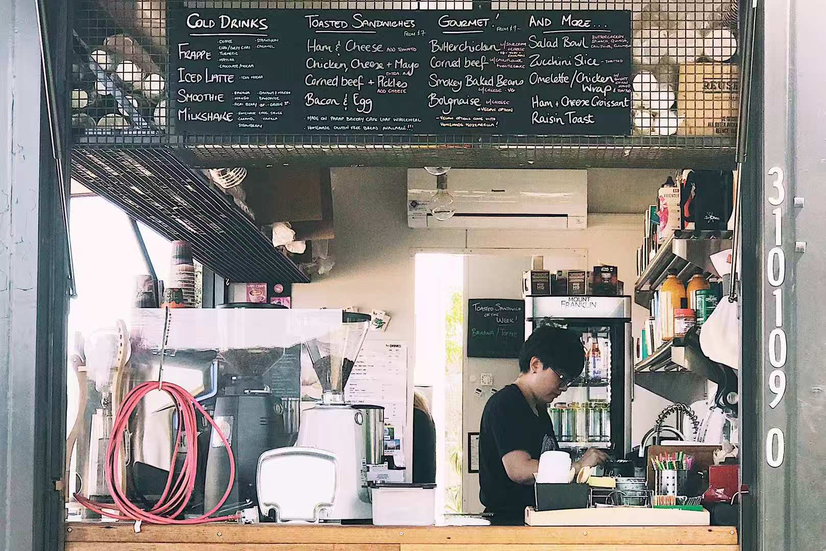 person working at coffee shop